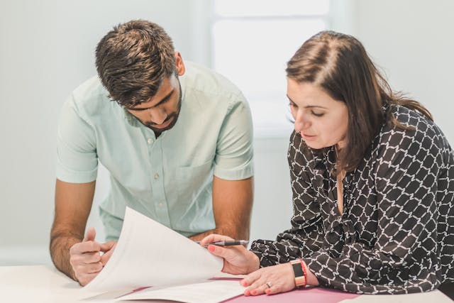 people-looking-at-papers-in-home people-looking-at-papers-in-home